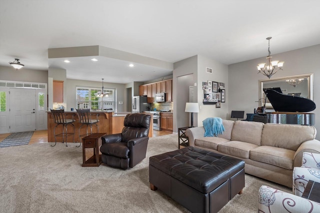 3259 Emmertsen Rd, Racine, WI 53406 - living room with a chandelier, light carpet, and recessed lighting