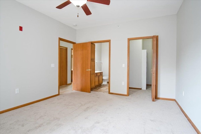 6701 Fairhaven Rd Unit 202, Madison, WI 53719 - unfurnished bedroom featuring light colored carpet, connected bathroom, and ceiling fan