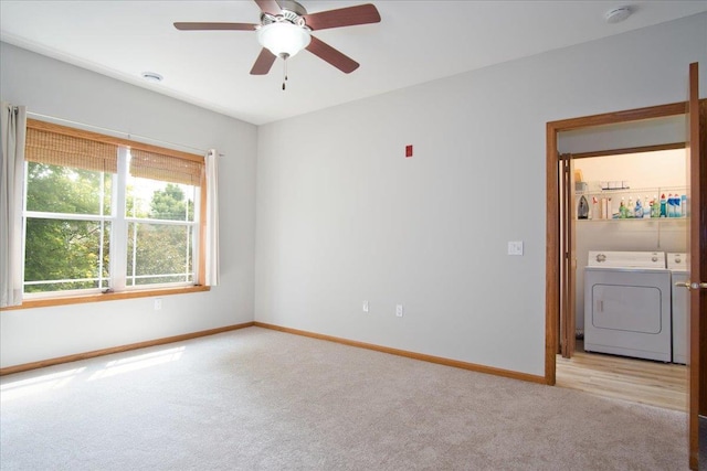 6701 Fairhaven Rd Unit 202, Madison, WI 53719 - empty room featuring separate washer and dryer, light colored carpet, a smoke detector, and ceiling fan