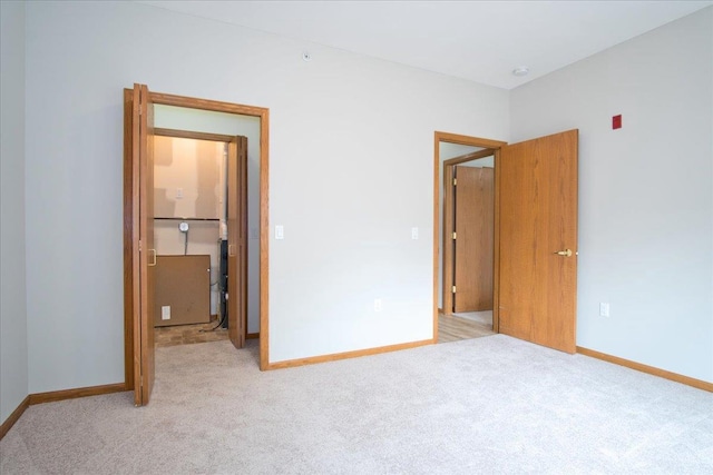 6701 Fairhaven Rd Unit 202, Madison, WI 53719 - unfurnished bedroom with light colored carpet and baseboards