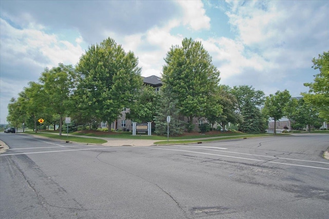 6701 Fairhaven Rd Unit 202, Madison, WI 53719 - view of asphalt street with traffic signs, sidewalks, and curbs