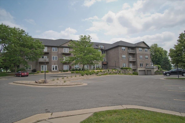 6701 Fairhaven Rd Unit 202, Madison, WI 53719 - view of building exterior featuring uncovered parking