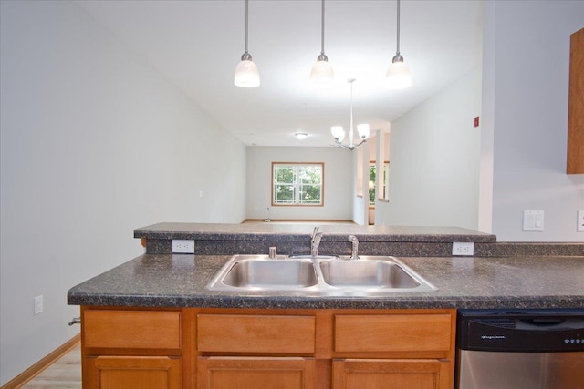 6701 Fairhaven Rd Unit 202, Madison, WI 53719 - kitchen featuring dishwasher, dark countertops, decorative light fixtures, and wood finished floors