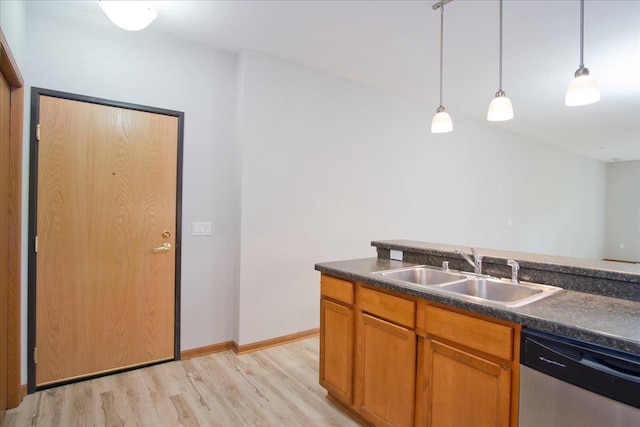 6701 Fairhaven Rd Unit 202, Madison, WI 53719 - kitchen featuring stainless steel dishwasher, light wood-style flooring, dark countertops, and decorative light fixtures