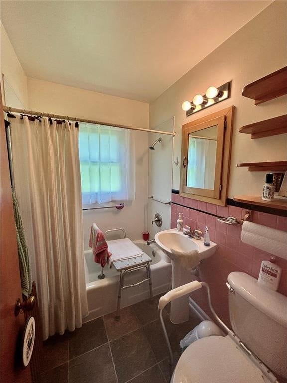 306 Pleasant Ave, Frederic, WI 54837 - full bathroom with shower / bath combo with shower curtain, tile patterned flooring, and tile walls