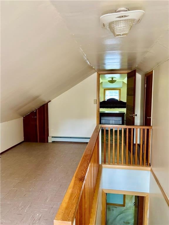 306 Pleasant Ave, Frederic, WI 54837 - corridor with a baseboard heating unit and lofted ceiling