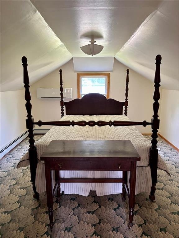 306 Pleasant Ave, Frederic, WI 54837 - carpeted bedroom with an AC wall unit and vaulted ceiling