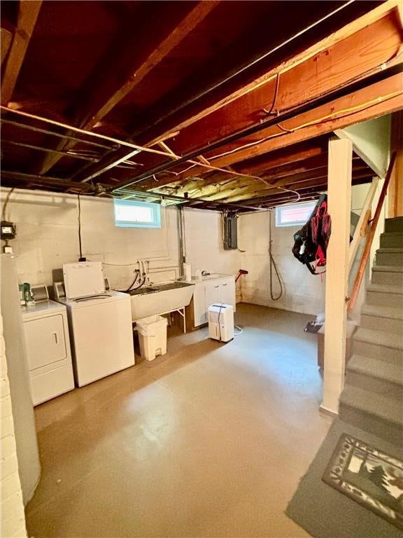 306 Pleasant Ave, Frederic, WI 54837 - below grade area featuring separate washer and dryer, stairway, and electric panel