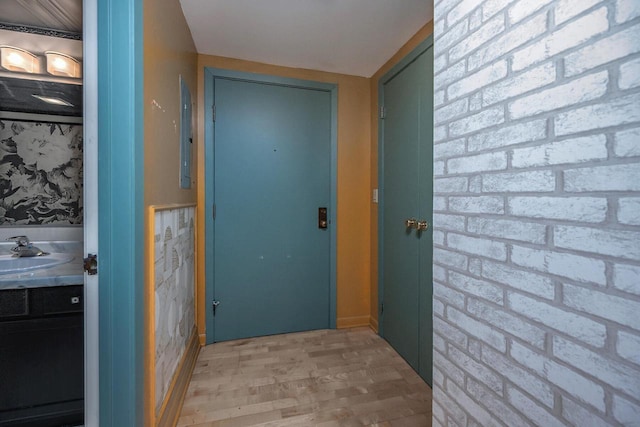 1633 N Prospect Ave Unit 18F, Milwaukee, WI 53202 - hall with light wood-style floors and a sink