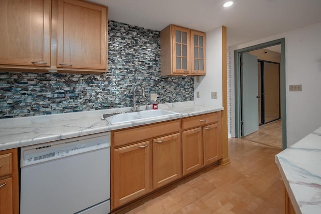 1633 N Prospect Ave Unit 18F, Milwaukee, WI 53202 - kitchen featuring white dishwasher, decorative backsplash, glass insert cabinets, light wood-type flooring, and light stone counters