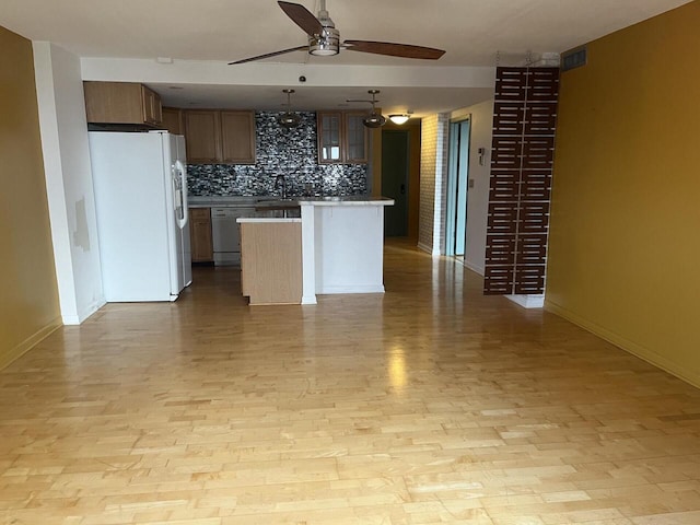 1633 N Prospect Ave Unit 18F, Milwaukee, WI 53202 - kitchen featuring white fridge with ice dispenser, ceiling fan, backsplash, dishwasher, and light wood-style floors