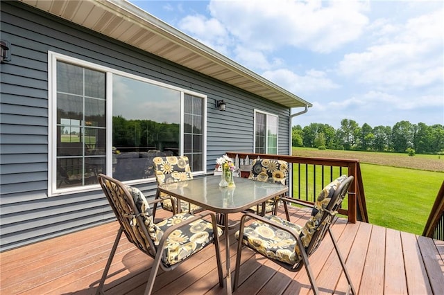 4801 358th St, Stanley, WI 54768 - wooden deck featuring outdoor dining space and a lawn