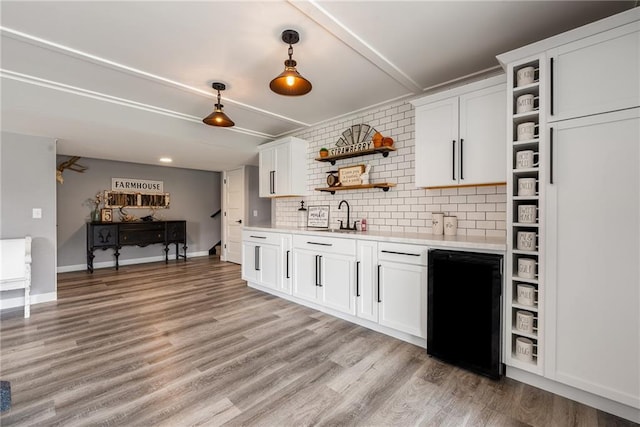 4801 358th St, Stanley, WI 54768 - kitchen featuring open shelves, refrigerator, light countertops, and backsplash