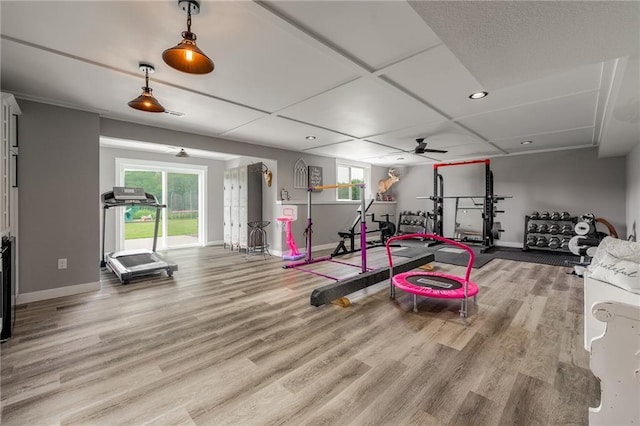 4801 358th St, Stanley, WI 54768 - exercise area featuring ceiling fan, plenty of natural light, wood finished floors, and recessed lighting