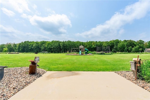 4801 358th St, Stanley, WI 54768 - view of patio featuring a trampoline