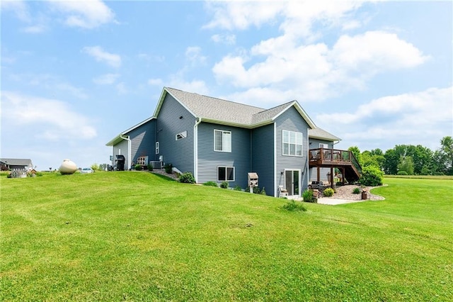 4801 358th St, Stanley, WI 54768 - rear view of property featuring a deck, a yard, and a patio area
