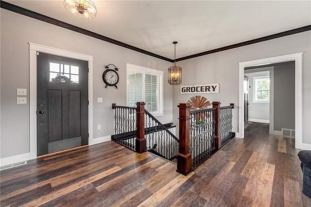 4801 358th St, Stanley, WI 54768 - foyer entrance with a chandelier, wood finished floors, and ornamental molding