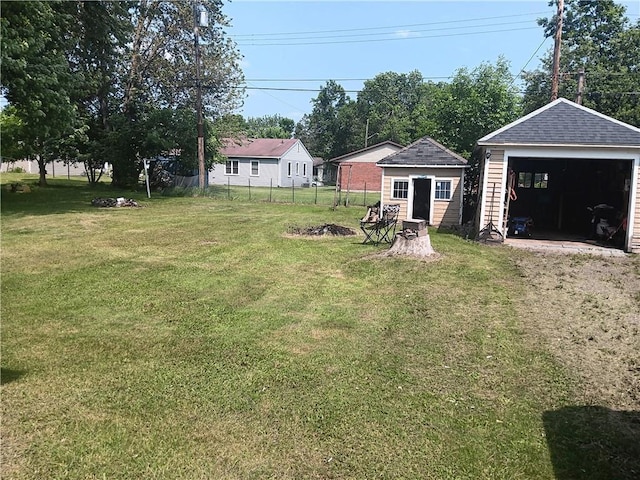 905 E 1st St, Ladysmith, WI 54848 - view of yard featuring a detached garage and an outdoor structure