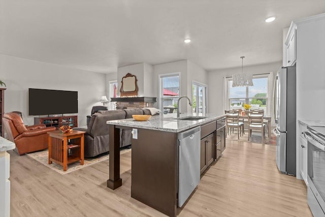 N9225 Constellation Dr, Appleton, WI 54915 - kitchen featuring stainless steel appliances, light wood-style flooring, a chandelier, open floor plan, and recessed lighting