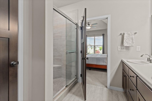 N9225 Constellation Dr, Appleton, WI 54915 - bathroom with a ceiling fan, a shower stall, double vanity, and ensuite bath