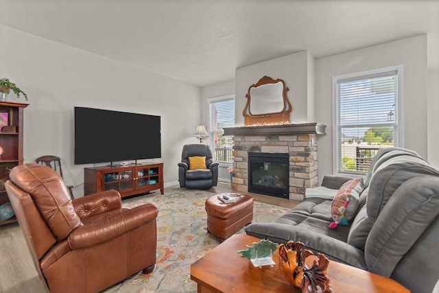 N9225 Constellation Dr, Appleton, WI 54915 - living area featuring a stone fireplace and wood finished floors