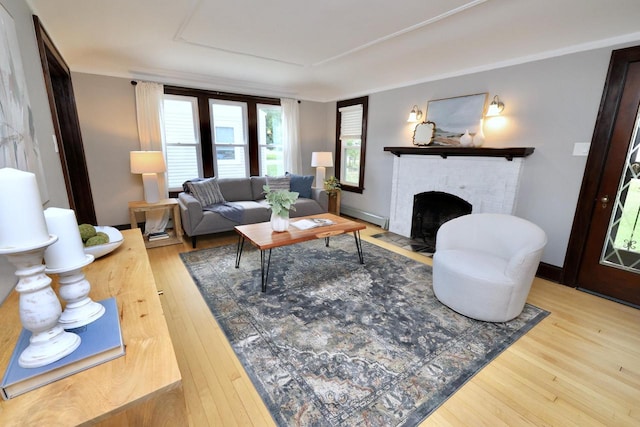 1522 S Sunny Slope Rd, New Berlin, WI 53151 - living area with wood finished floors, a brick fireplace, and baseboard heating