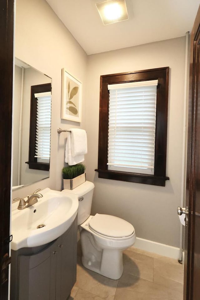 1522 S Sunny Slope Rd, New Berlin, WI 53151 - half bathroom featuring vanity and tile patterned floors