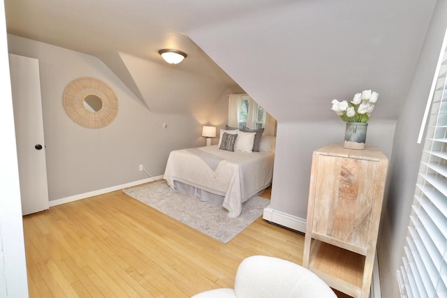 1522 S Sunny Slope Rd, New Berlin, WI 53151 - bedroom featuring wood finished floors and vaulted ceiling