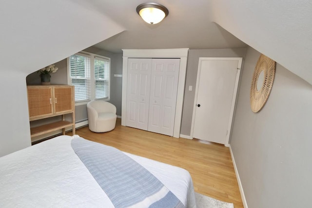 1522 S Sunny Slope Rd, New Berlin, WI 53151 - bedroom featuring wood finished floors and a baseboard heating unit