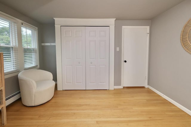 1522 S Sunny Slope Rd, New Berlin, WI 53151 - sitting room featuring a baseboard heating unit and light wood finished floors