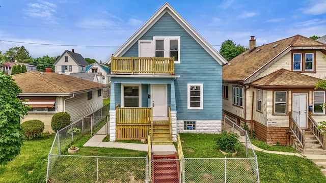 3425 N 20th St, Milwaukee, WI 53206 - view of front of home featuring entry steps, a balcony, a gate, and a fenced front yard