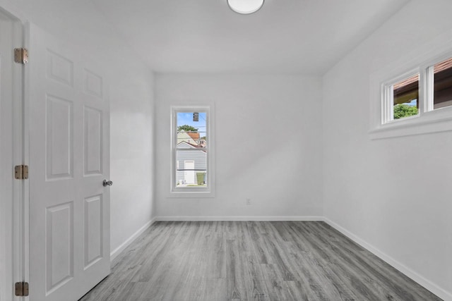 3425 N 20th St, Milwaukee, WI 53206 - empty room with plenty of natural light and wood finished floors