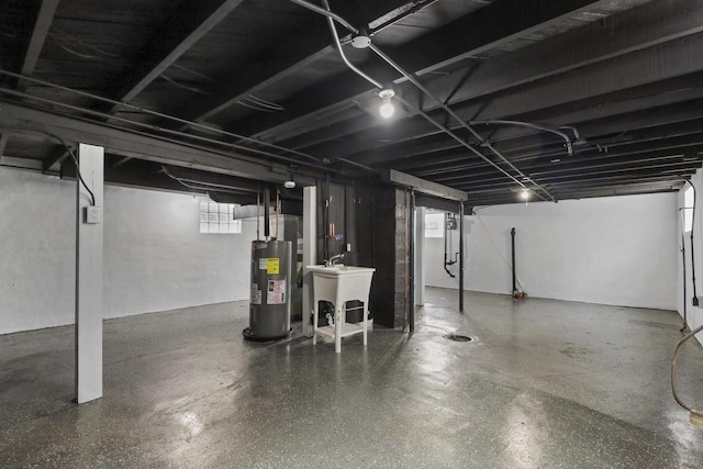3425 N 20th St, Milwaukee, WI 53206 - basement with electric water heater and a sink