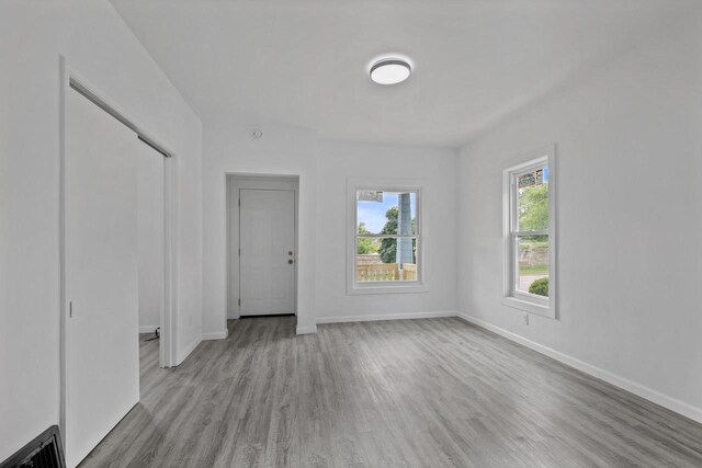 3425 N 20th St, Milwaukee, WI 53206 - unfurnished living room featuring wood finished floors