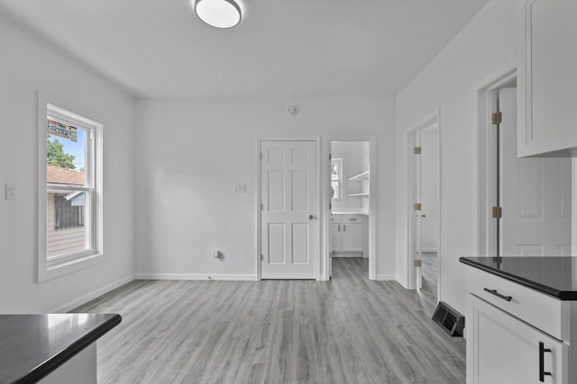 3425 N 20th St, Milwaukee, WI 53206 - unfurnished living room featuring light wood-type flooring
