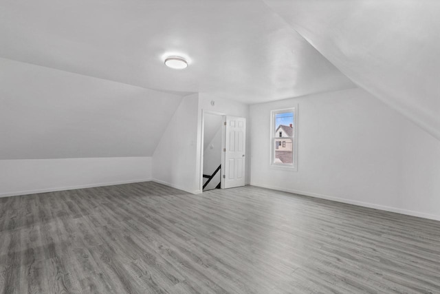 3425 N 20th St, Milwaukee, WI 53206 - additional living space featuring lofted ceiling and wood finished floors