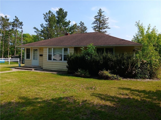 102 E College Ave, Ladysmith, WI 54848 - view of front facade featuring a front yard and a chimney
