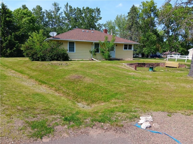 102 E College Ave, Ladysmith, WI 54848 - back of property with a chimney and a lawn