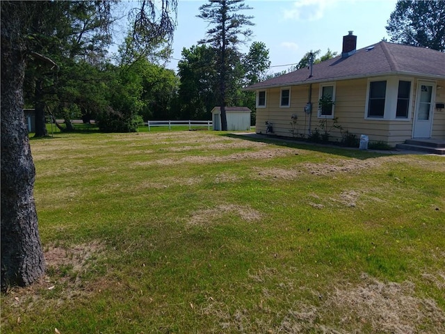 102 E College Ave, Ladysmith, WI 54848 - view of yard featuring a storage unit