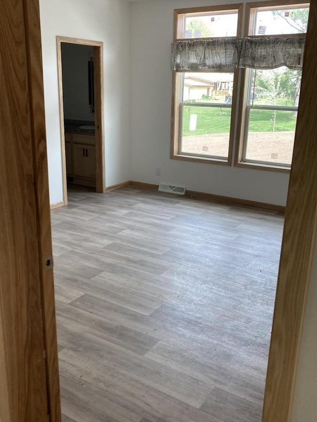 501 View St, Tomah, WI 54660 - empty room featuring plenty of natural light and wood finished floors