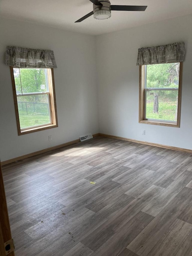 501 View St, Tomah, WI 54660 - empty room with wood finished floors and a ceiling fan
