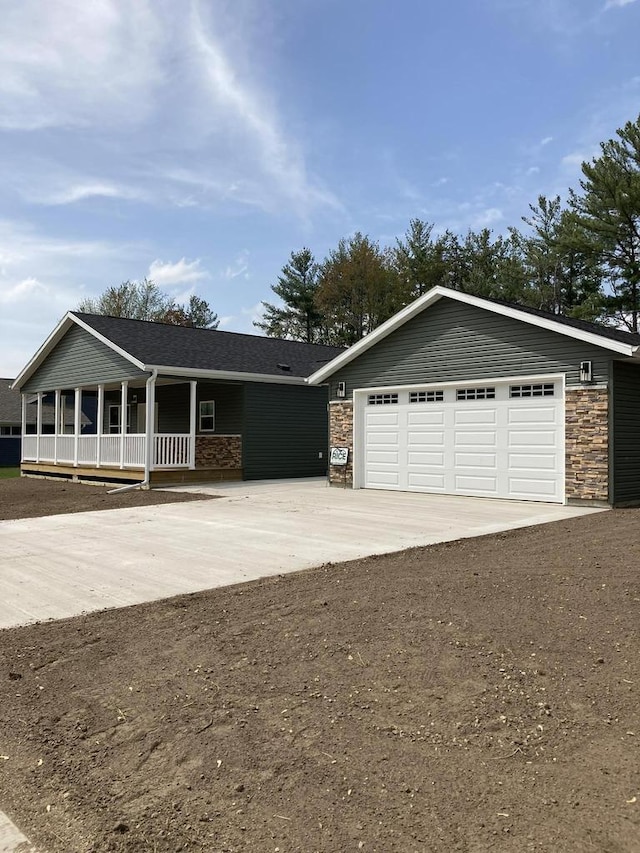 501 View St, Tomah, WI 54660 - single story home featuring concrete driveway, stone siding, a porch, and a shingled roof