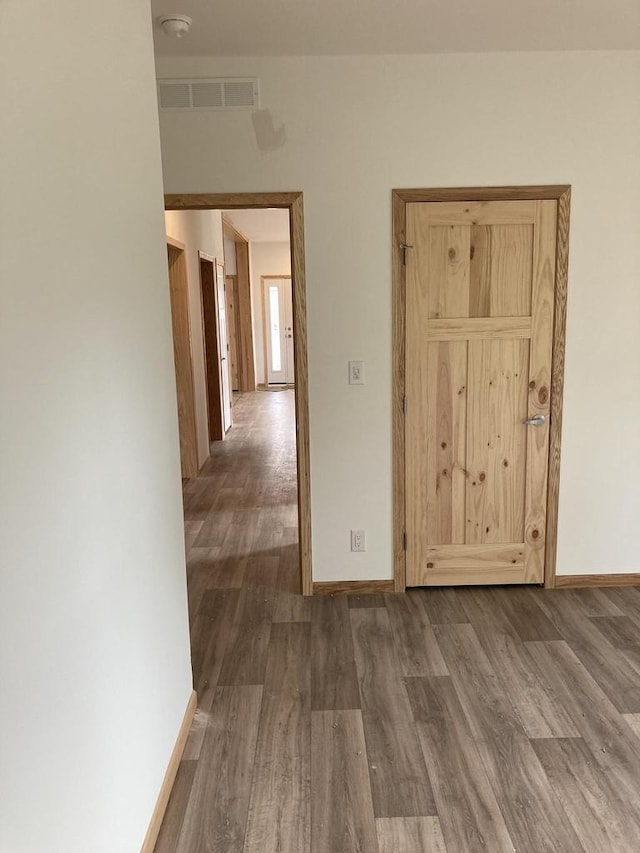 501 View St, Tomah, WI 54660 - spare room featuring wood finished floors and a smoke detector