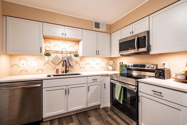 1906 E Shorewood Blvd Unit 250, Shorewood, WI 53211 - kitchen featuring appliances with stainless steel finishes, light countertops, white cabinetry, and dark wood-style flooring