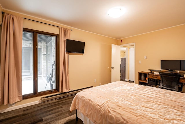 1906 E Shorewood Blvd Unit 250, Shorewood, WI 53211 - bedroom with baseboard heating and dark wood finished floors
