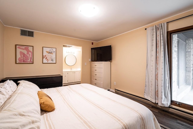1906 E Shorewood Blvd Unit 250, Shorewood, WI 53211 - bedroom with a baseboard radiator, ensuite bathroom, and wood finished floors