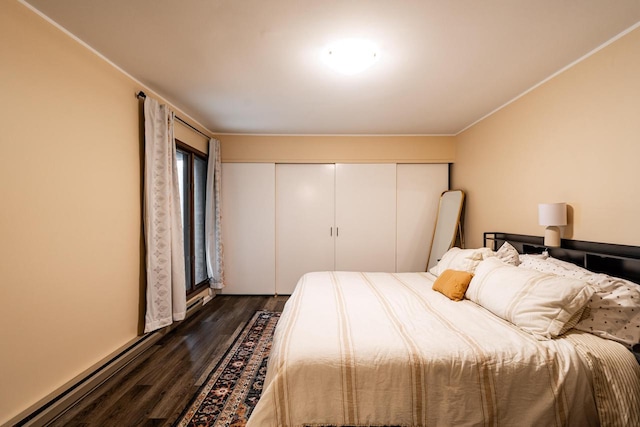 1906 E Shorewood Blvd Unit 250, Shorewood, WI 53211 - bedroom with dark wood-style flooring, a closet, and ornamental molding