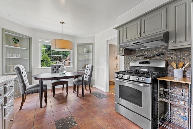 10836 W Fiebrantz Ave, Wauwatosa, WI 53222 - kitchen featuring stainless steel gas range oven, under cabinet range hood, decorative backsplash, gray cabinetry, and light countertops