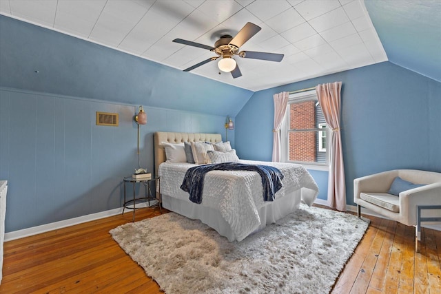 10836 W Fiebrantz Ave, Wauwatosa, WI 53222 - bedroom featuring hardwood / wood-style floors, vaulted ceiling, and ceiling fan