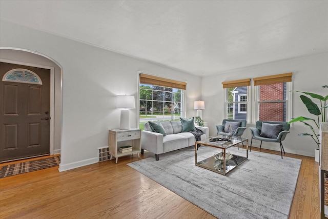 10836 W Fiebrantz Ave, Wauwatosa, WI 53222 - living area with arched walkways and wood finished floors